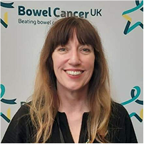 A headshot photograph of Claire Coughlan smiling. 
