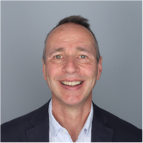 A headshot photograph of Richard Wilson smiling. 